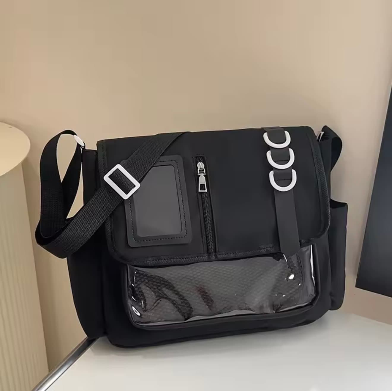 The black D-Ring Messenger bag with silver-tone rings and an adjustable shoulder strap